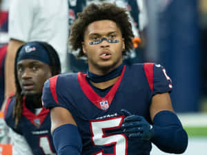 Focused Football Player On Field Wallpaper