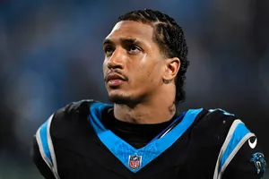 Focused Football Player Portrait Wallpaper