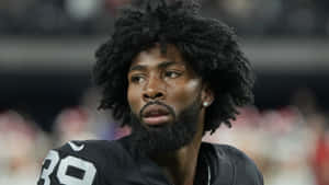 Focused Football Player Portrait Wallpaper