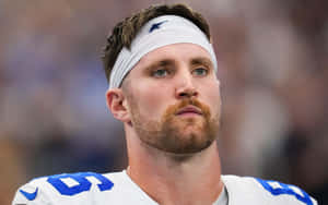 Focused Football Player Portrait Dalton Schultz Wallpaper