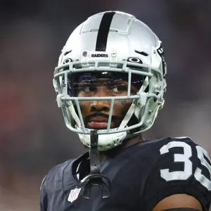 Focused Football Player Portrait Wallpaper