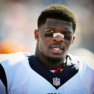 Focused Football Player Portrait Wallpaper