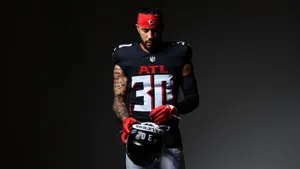 Focused Football Player Portrait Wallpaper