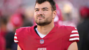 Focused Football Player Portrait Wallpaper