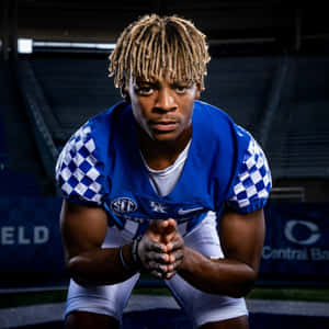 Focused Football Player Portrait Wallpaper