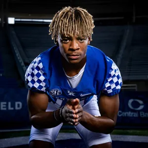 Focused Football Player Portrait Wallpaper