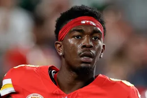 Focused Football Player Portrait Wallpaper