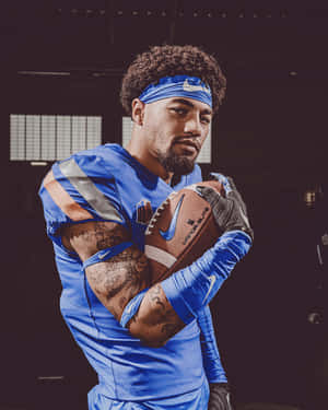 Focused Football Player Portrait Wallpaper