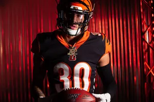 Focused Football Player Portrait Wallpaper