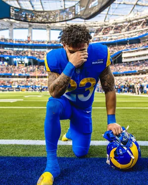 Focused Football Player Pre Game Moment Wallpaper