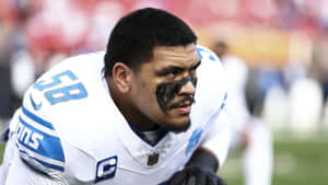 Focused Football Player Pregame Wallpaper