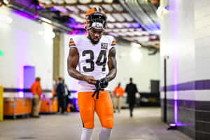 Focused Football Player Preparation Wallpaper