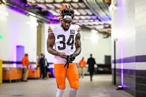 Focused Football Player Preparation Wallpaper