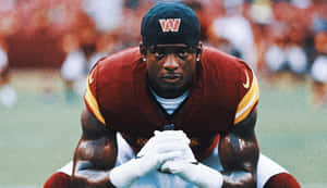 Focused Football Player Preparation Wallpaper