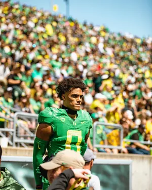 Focused Football Player Stadium Background Wallpaper