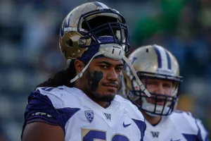 Focused Football Player Vita Vea Wallpaper