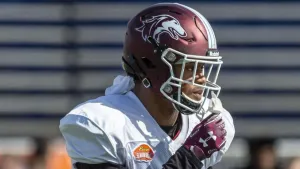 Focused Football Player Wearing Helmet Wallpaper