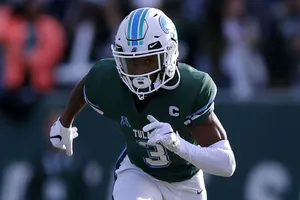 Focused Football Playerin Action Wallpaper