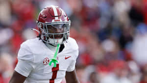 Focused Football Playerin Game Wallpaper