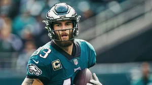 Focused Football Playerwith Captains Patch Wallpaper