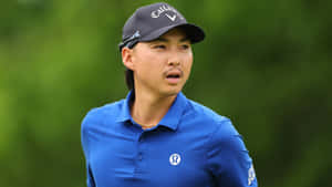 Focused Golferin Blue Wallpaper