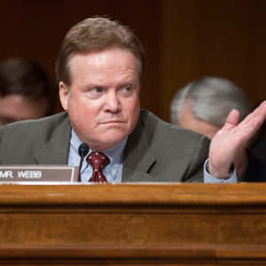 Focused Jim Webb - A Portrait Of Concentration Wallpaper