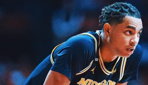 Focused Michigan Basketball Player Jett Howard Wallpaper