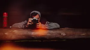 Focused_ Photographer_at_ Work Wallpaper