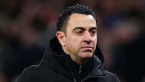 Focused Soccer Coach Xavi Wallpaper