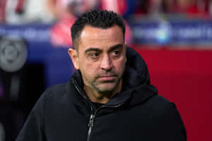 Focused Soccer Coach Xavi Hernandez Wallpaper