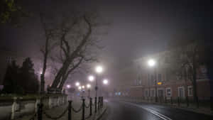 Foggy_ Night_ Street_ Scene Wallpaper