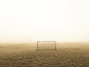 Foggy Soccer Fieldwith Goals.jpg Wallpaper