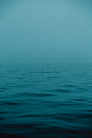 Foggy Teal Ocean Wallpaper