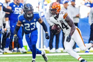 Football Action Jerome Ford Evades Defender Wallpaper