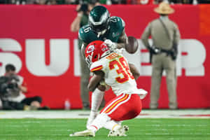 Football Action Tackle Kansas City Chiefsvs Philadelphia Eagles Wallpaper