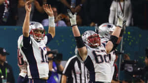 Football Athletes Joe Thuney And Tom Brady Wallpaper