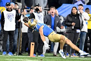 Football Catch Attemptat Endzone Wallpaper