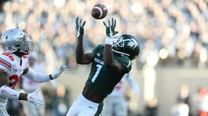 Football Catch In Action Wallpaper