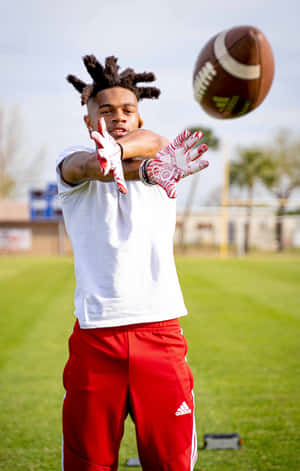 Football Catch Practice Outdoors Wallpaper