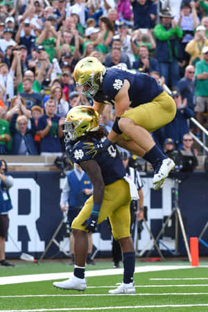 Football Celebration Jump Notre Dame Wallpaper