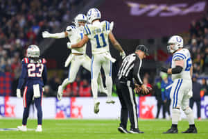 Football Celebration Midair Jump Wallpaper