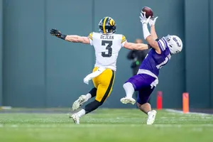 Football Defensive Leap Catch Attempt Wallpaper