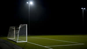 Football Field During Dark Night Wallpaper