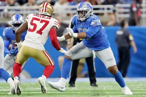 Football Matchup Greenlawvs Offensive Lineman Wallpaper