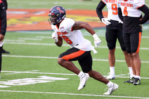 Football Player Action Shot Wallpaper