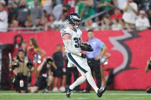 Football Player Action Shotin Rain Wallpaper