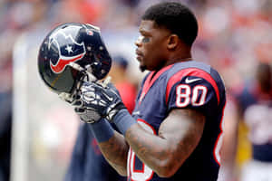 Football Player Andre Johnson Holding Helmet Wallpaper