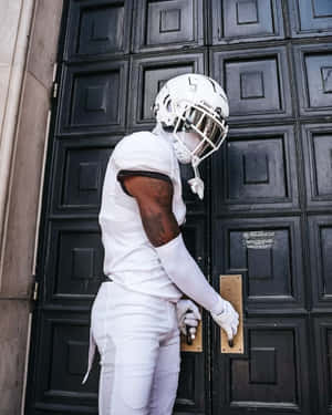 Football_ Player_at_ Black_ Door Wallpaper