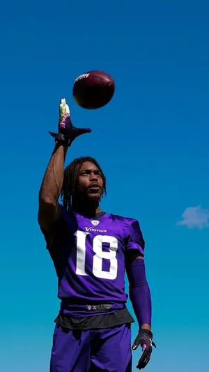 Football Player Balancing Ball Wallpaper