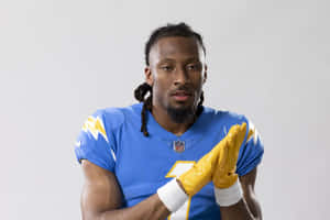 Football Player Blue Jersey Yellow Gloves Wallpaper